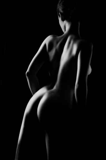 Naked nude woman back. Black and white nudity.