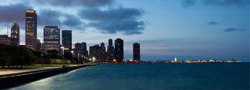 Chicago skyline and navy pier at dusk