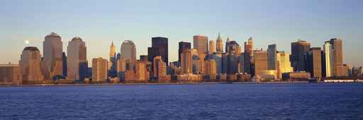 Panoramic view of full moon rising over lower Manhattan skyline, NY where World Trade Towers were located