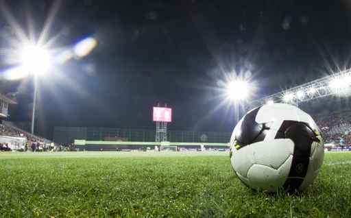 Soccer ball in stadium at night