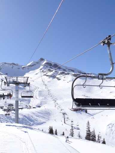 Ski lift carries skiers